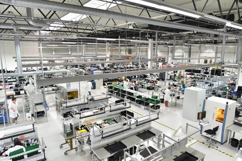 The inside of an industrial factory like Conduent has | Investment U