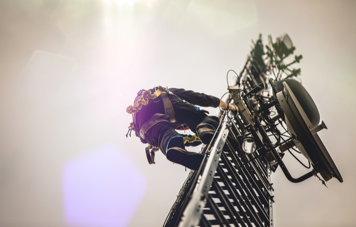 man-climbing-telecom-tower