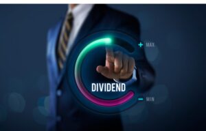 High dividend stocks can be a great play in a down market. Here a man in a business suit touches a screen that says "dividend."