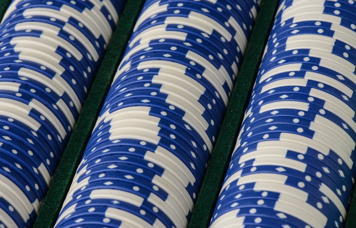 Rows of poker blue chips. High dividend blue chip stocks can be a great investment.