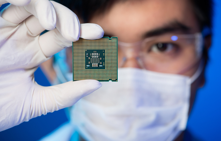 engineer looking at an Intel chip