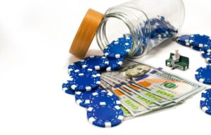 Blue poker chips and a stack of money representing blue chip stocks.