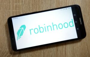 The Robinhood trading app on a cell phone screen seen here. Check out our review.